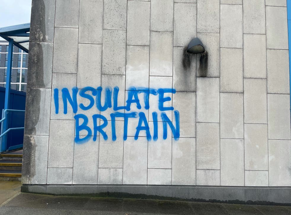 The words ‘Insulate Britain’ spray-painted on Crawley Magistrates’ court(Luke O’Reilly/PA)