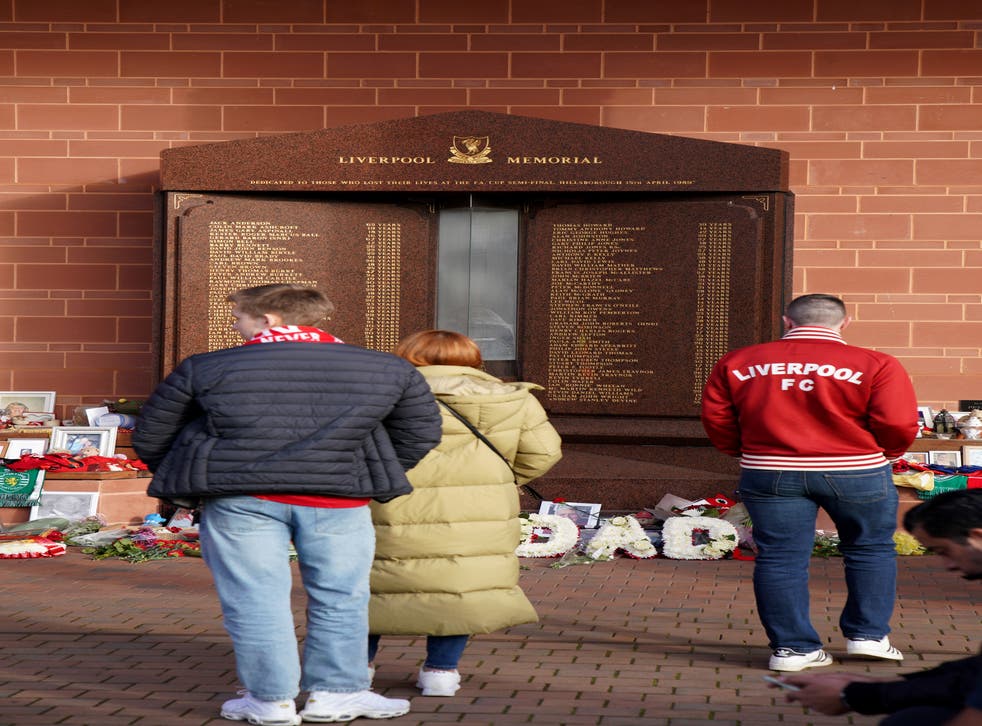 Liverpool fans visit the Hillsborough Memorial (Peter Byrne/PA)