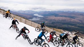 Cyclists take part in MacAvalanche, a mass start mountain bike race through the snow, descending over 900m from the summit of Aonach Mor in the Nevis Range near Fort William