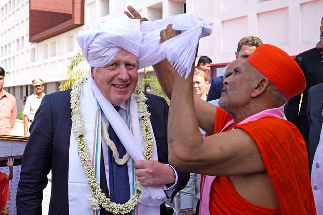 Prime Minister Boris Johnson is dressed in a turban during a visit to Gujarat Biotechnology University, in Gandhinagar, Gujarat, as part of his two day trip to India