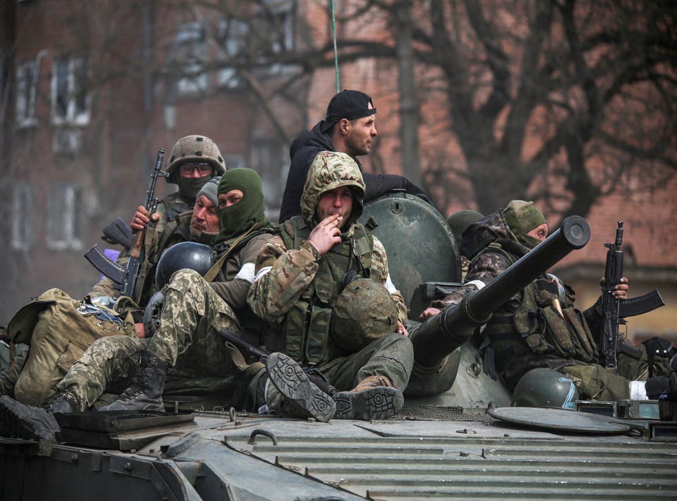 <p>An armoured convoy of pro-Russian troops moves along a road in Mariupol</p>