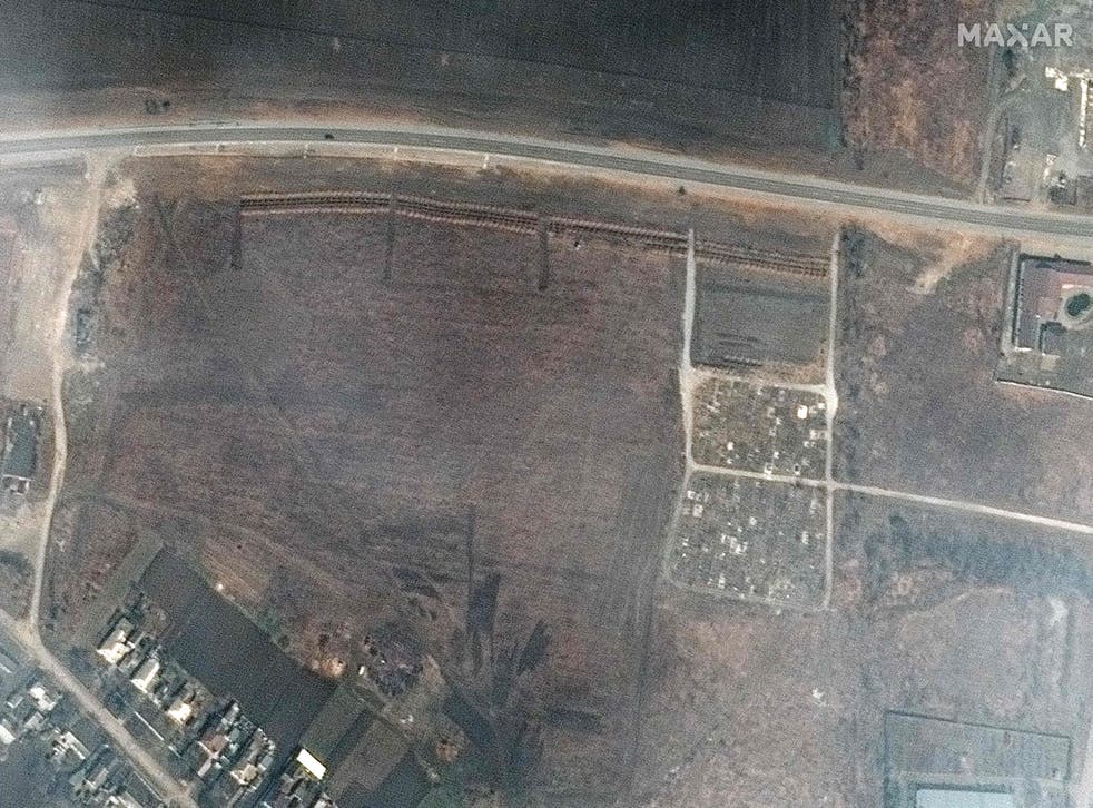 <p>This satellite image released by Maxar Technologies on 21 April 2022, shows an overview of a cemetery and early expansion of graves site on the northwestern edge of Manhush, Ukraine</p>