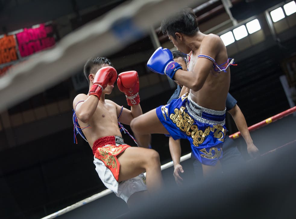 <p>Get your kicks: Muay Thai boxing at Rajadamnern Stadium</p>