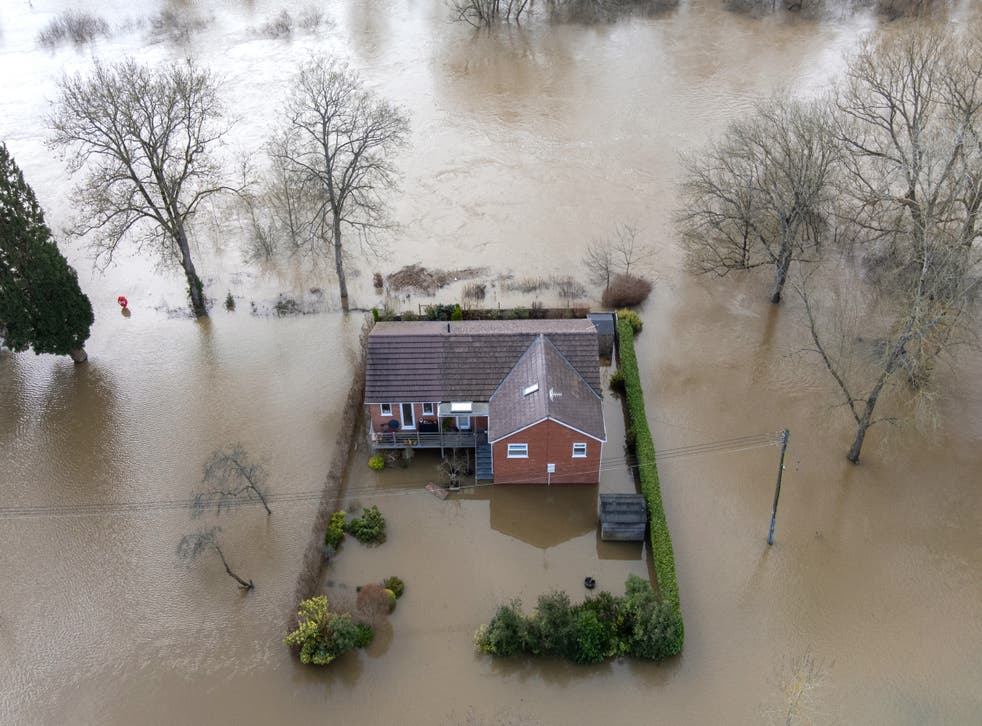 A property surrounded by floodwater after the River Severn burst its banks at Bewdley in Worcestershire following high rainfall from Storm Franklin in February 2022 (Joe Giddens/PA)
