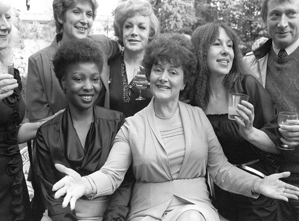 <p>Cynthia Payne (centre) and friends at her Streatham home, where a party was given to launch her memoir</p>