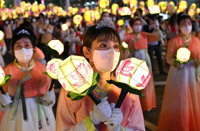 Participants march during a lantern parade as part of a Lotus Lantern Festival to celebrate the upcoming Buddha’s birthday, in Seoul