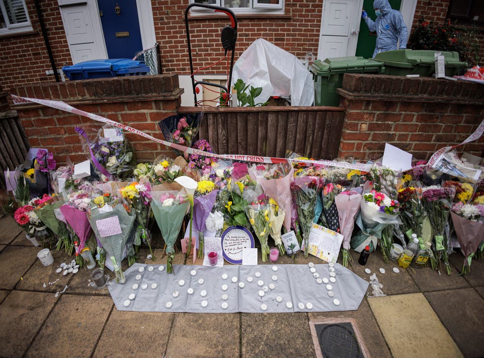 <p> Floral tributes are left outside a property in Bermondsey</bl>