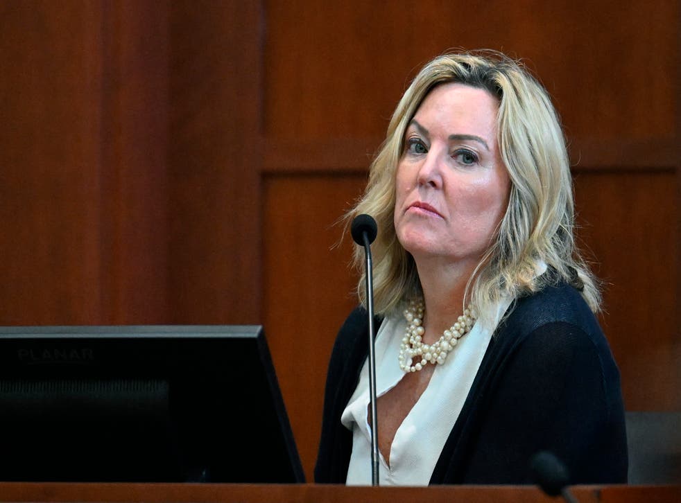 <p>Forensic psychologist Dr. Dawn Hughes testifies as the first defense witness for actress Amber Heard at the Fairfax County Circuit Court in Fairfax, Va., Tuesday May 3, 2022.</p>