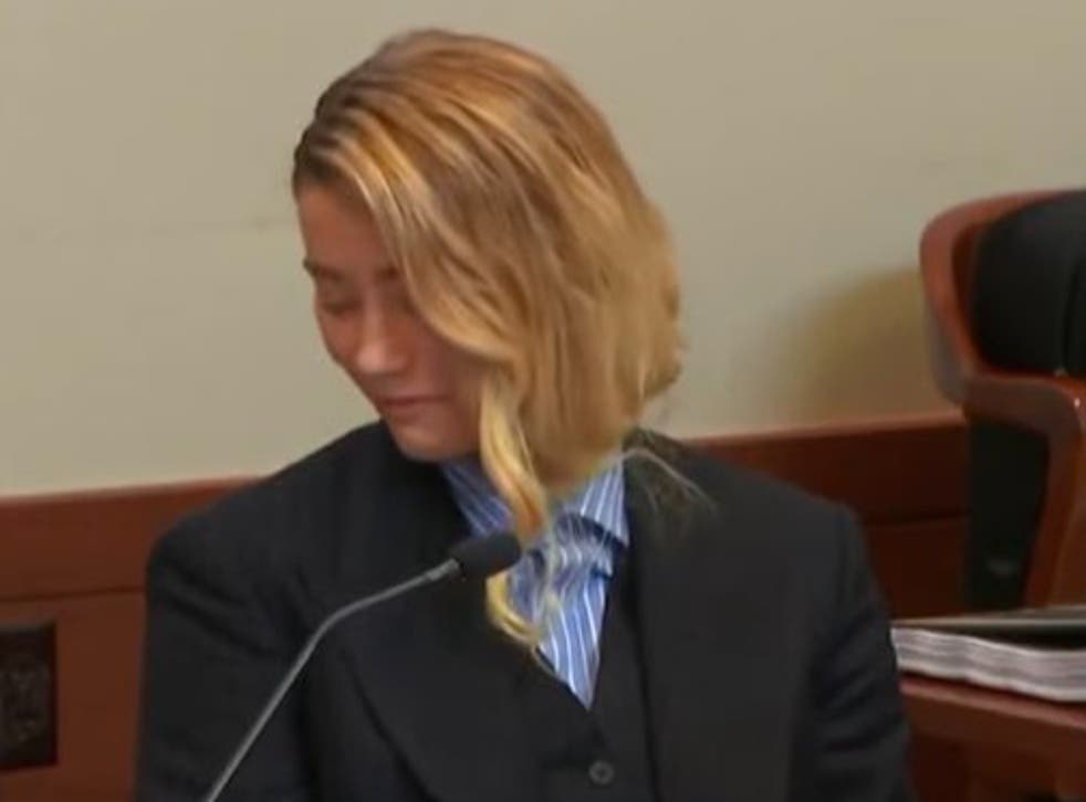 <p>Amber Heard could be seen smiling in court during Dr Dawn Hughes’ testimony</s>
