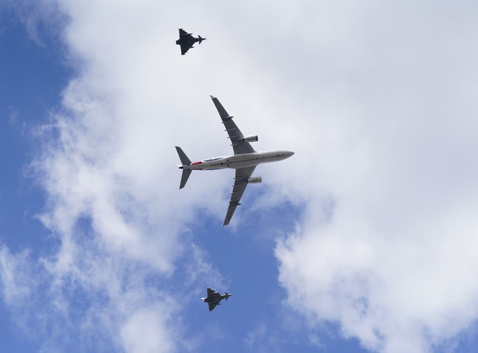 An Airbus KC2 Voyager and two RAF Eurofighter Typhoons formed the flypast over Horse Guards Parade (Stefan Rousseau/PA)