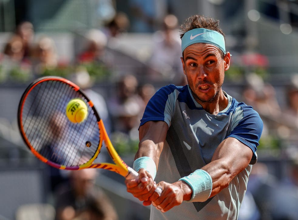 Rafael Nadal returns the ball in his thrilling victory over David Goffin (Manu Fernandez/AP)