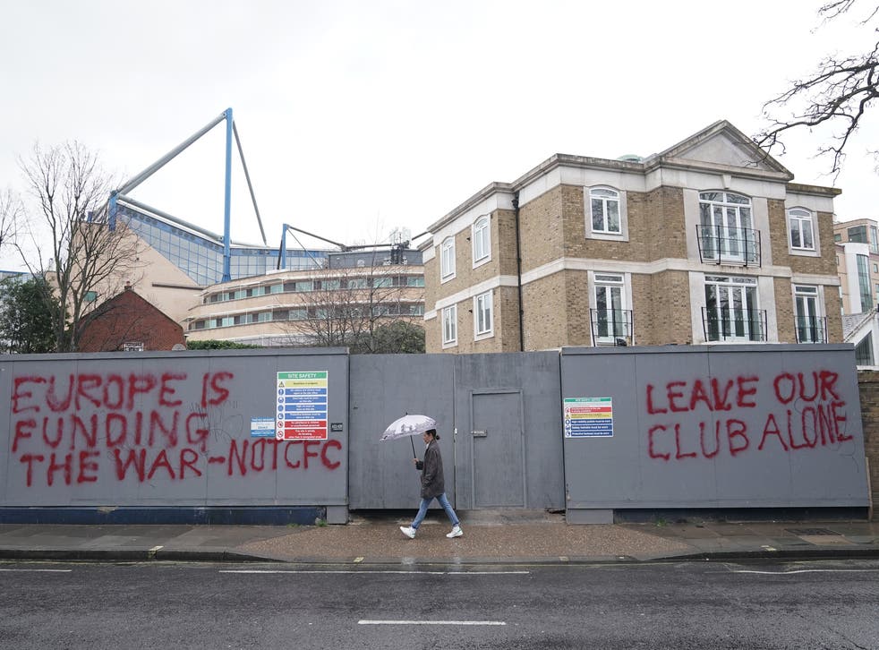Graffiti close to Stamford Bridge shows the strength of feeling around the Chelsea sale (Yui Mok/PA)