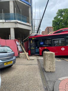 Front of bus smashed as it crashes into building in south London