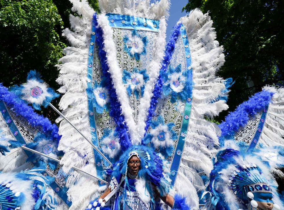 Performers take part in a ‘This is the City’ carnival through the streets of Coventry (Jacob King/PA)