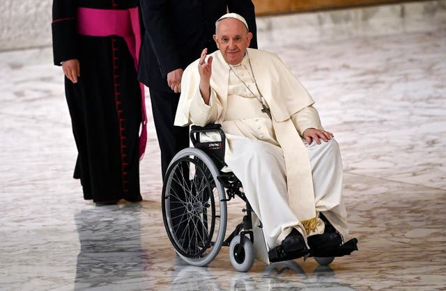 Pope Francis in a wheelchair attends an audience with pilgrims of the Institute of the Religious Teachers Filippini in the Paul VI hall, Vatican City