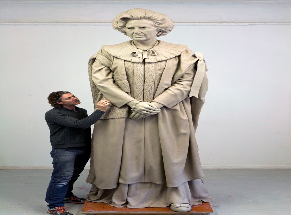 Sculptor Douglas Jennings working on his statue of Margaret Thatcher (Douglas Jennings/PA)