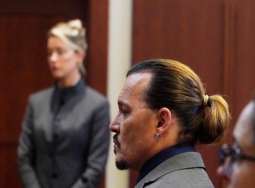 The jury was shown photographs in which Ms Heard appeared to have marks on her arms, which she said were scars caused by Mr Depp (Steve Heber/AP)
