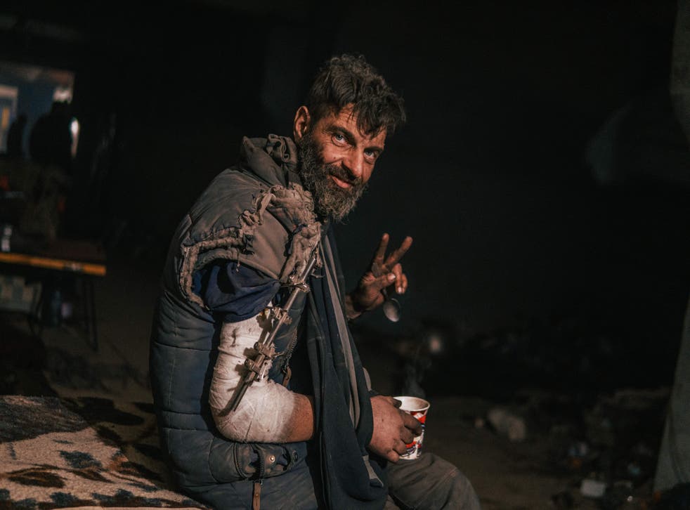 <p>This photo released on 10 May 2022 by the Azov regiment shows an injured Ukrainian serviceman inside the Azovstal iron and steel works factory in eastern Mariupol, Ukraine, amid the Russian invasion</p>