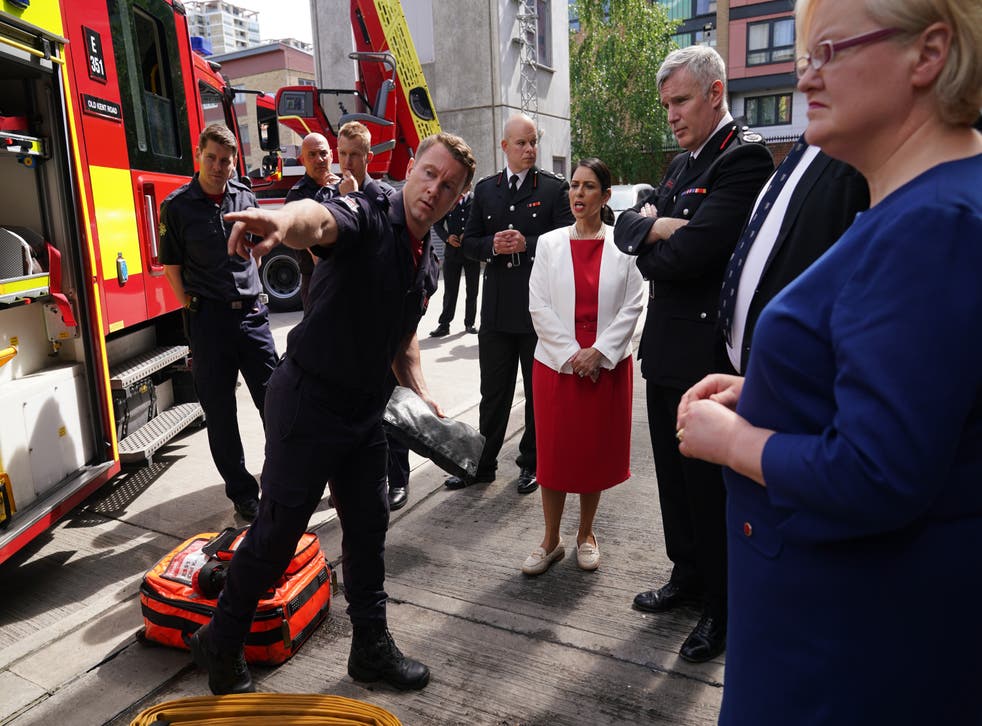 Home Secretary Priti Patel and London Fire Brigade Commissioner Andy Roe (second right) during visit to visit Old Kent Road Fire Station (Yui Mok/PA)