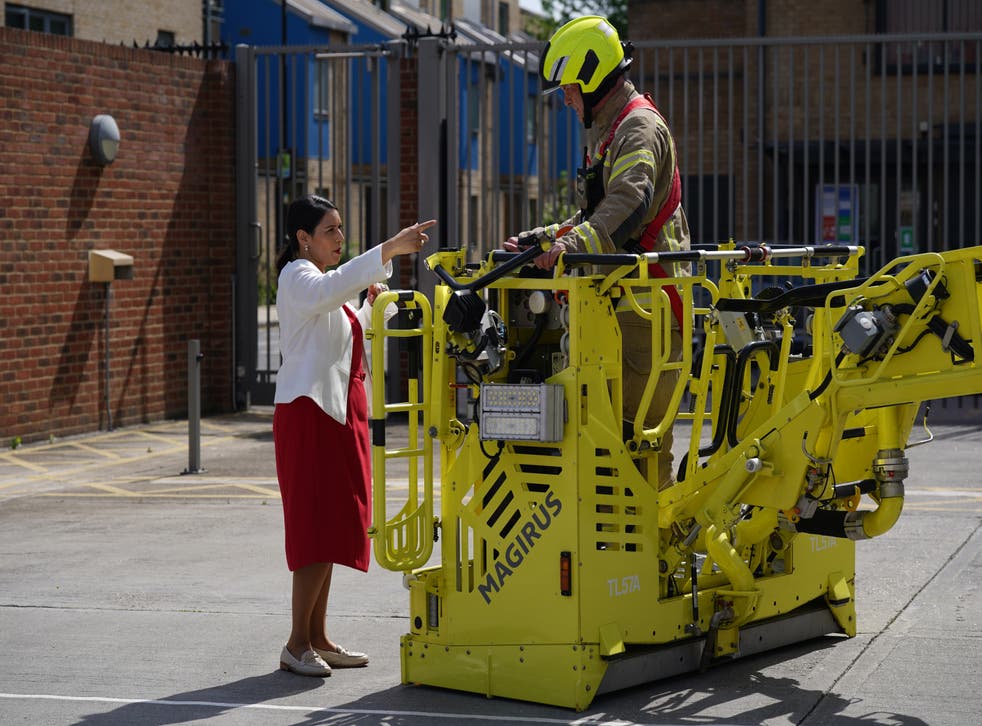 Home Secretary Priti Patel speaks to firefighter during a visit to Old Kent Road Fire Station, Southwark, south east London on Wednesday (Yui Mok/PA)