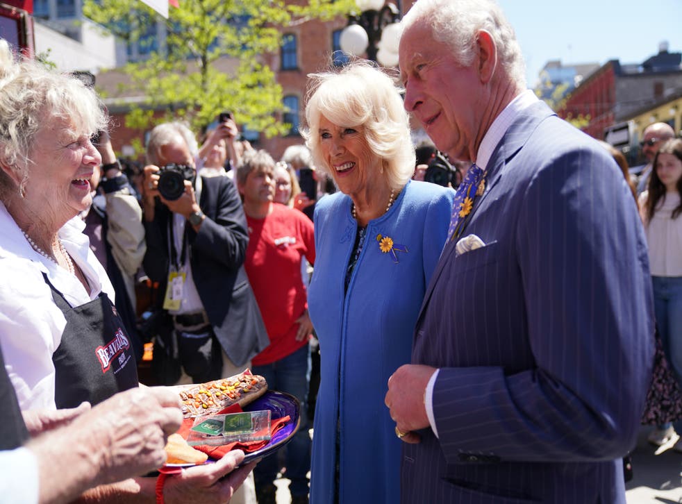 The Prince of Wales and Duchess of Cornwall are shown local produce at ByWard Market in Ottawa(Jacob King/PA)