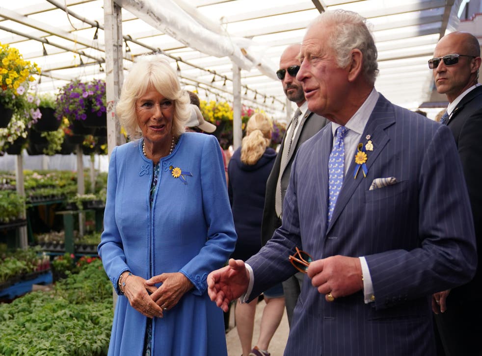 The Prince of Wales and Duchess of Cornwall during a visit to meet local market producers and merchants at ByWard Market in Ottawa (Jacob King/PA)