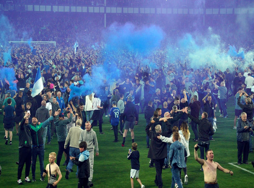 There were two pitch invasions as Everton fans celebrated (Peter Byrne/AP)