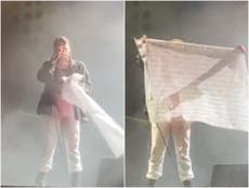 My Chemical Romance wave flag with names of fans who died during pandemic on stage