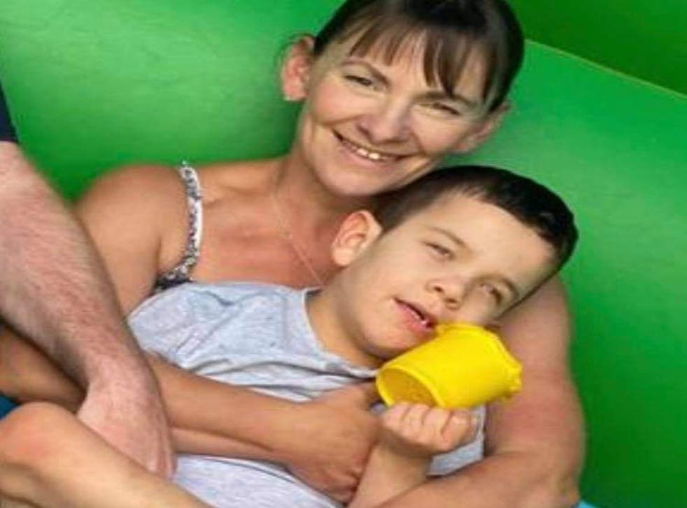 <p>Emma Sutton with her 7-year-old son Oscar, who suffers from seizures and benefits from Mr Bailey’s cannabis oil</p>