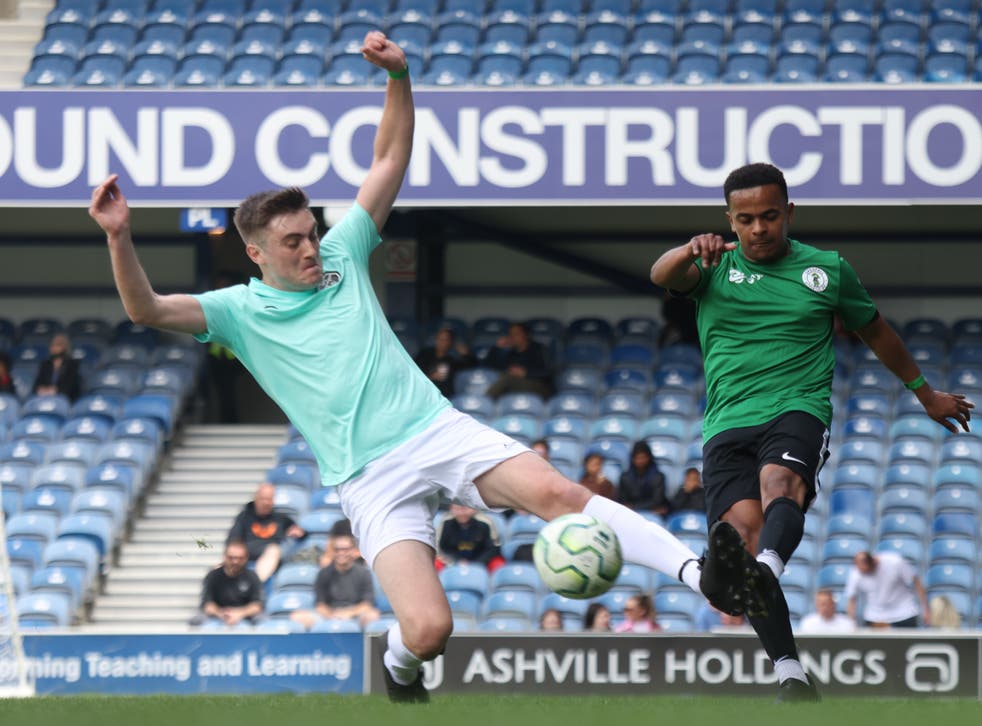 Grenfell AFC player Caleb Backer (right), shoots during a match against South London FC (James Manning/PA)