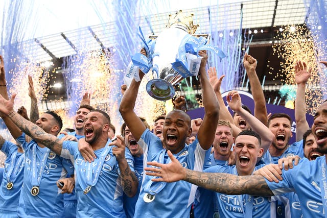 Fernandinho of Manchester City lifts the Premier League trophy after their side finished the season as Premier League champions  during the Premier League match between Manchester City and Aston Villa
