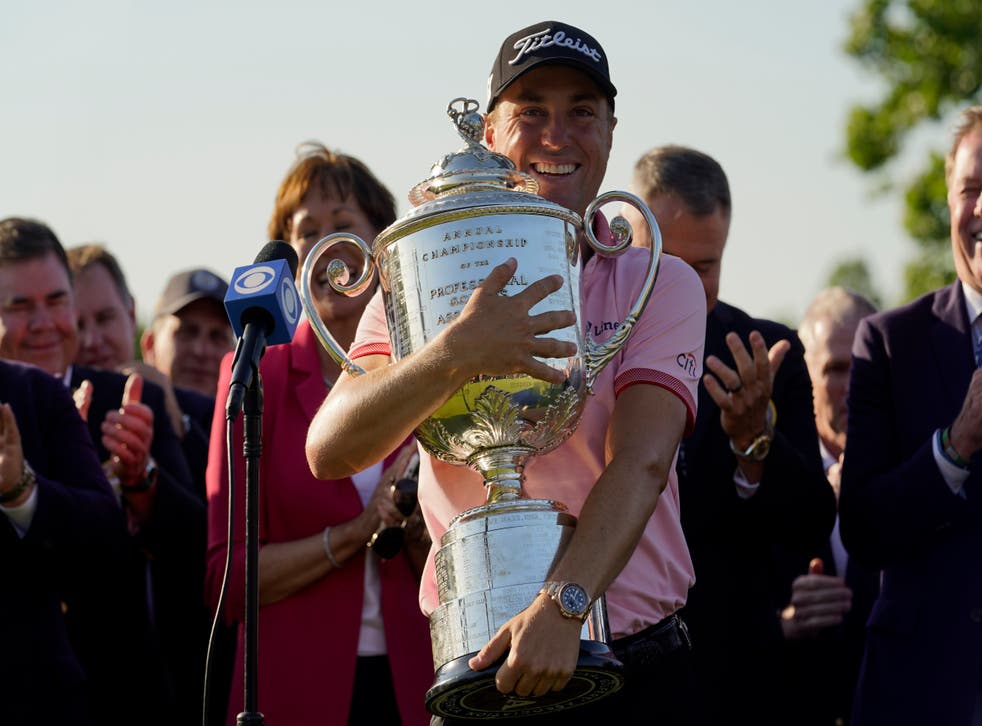 Justin Thomas holds the Wanamaker Trophy after winning the PGA Championship at Southern Hills Country Club (Eric Gay/AP)