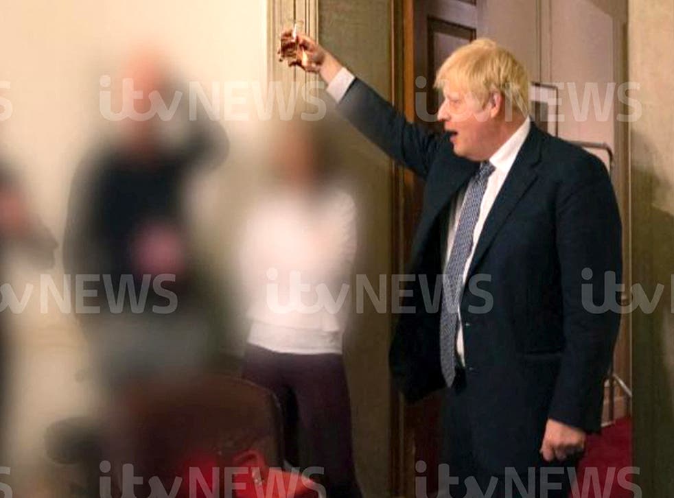 <p>Boris Johnson is pictured raising a glass for an apparent toast during the No 10 parti </s>