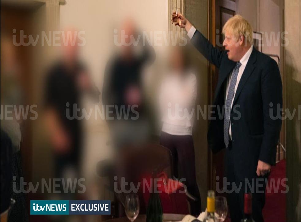 A photograph obtained by ITV News of the Prime Minister raising a glass at a leaving party on November 13 2020 (ITV/PA)