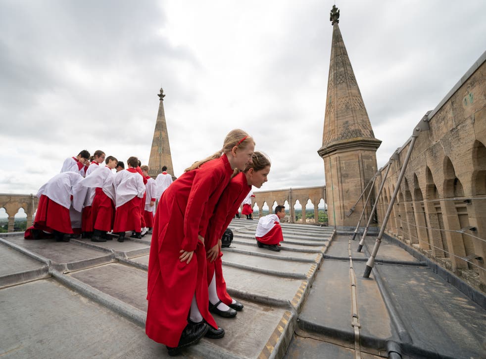 Girls joined the choir for the rooftop performance for the first time (Joe Giddens/ PA)