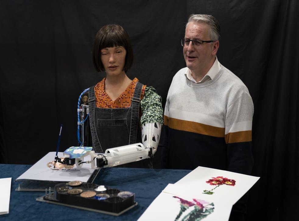 Ai-Da, the world’s first ultra-realistic robot ‘artist’, with creator Aidan Meller (Kirsty O’Connor/PA)