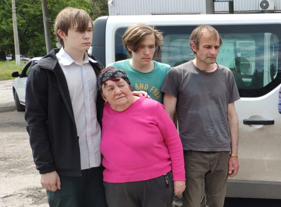<p>Vera Ivanova, 73, whose daughter Nataliya was killed by Russian shelling, with her grieving twin grandsons Maxim and Oleksandr, 14, and son-in-law Vladislav</s>