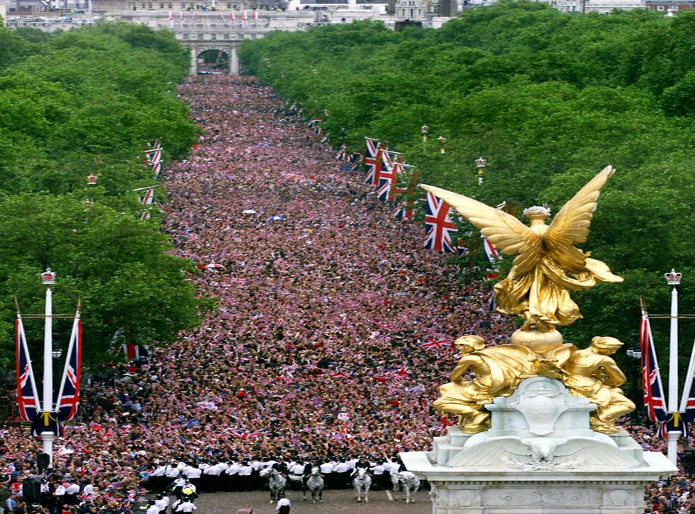 The scene from the roof of Buckingham Palace as crowds gather for the flypast in 2002 (Chris Ison/PA)