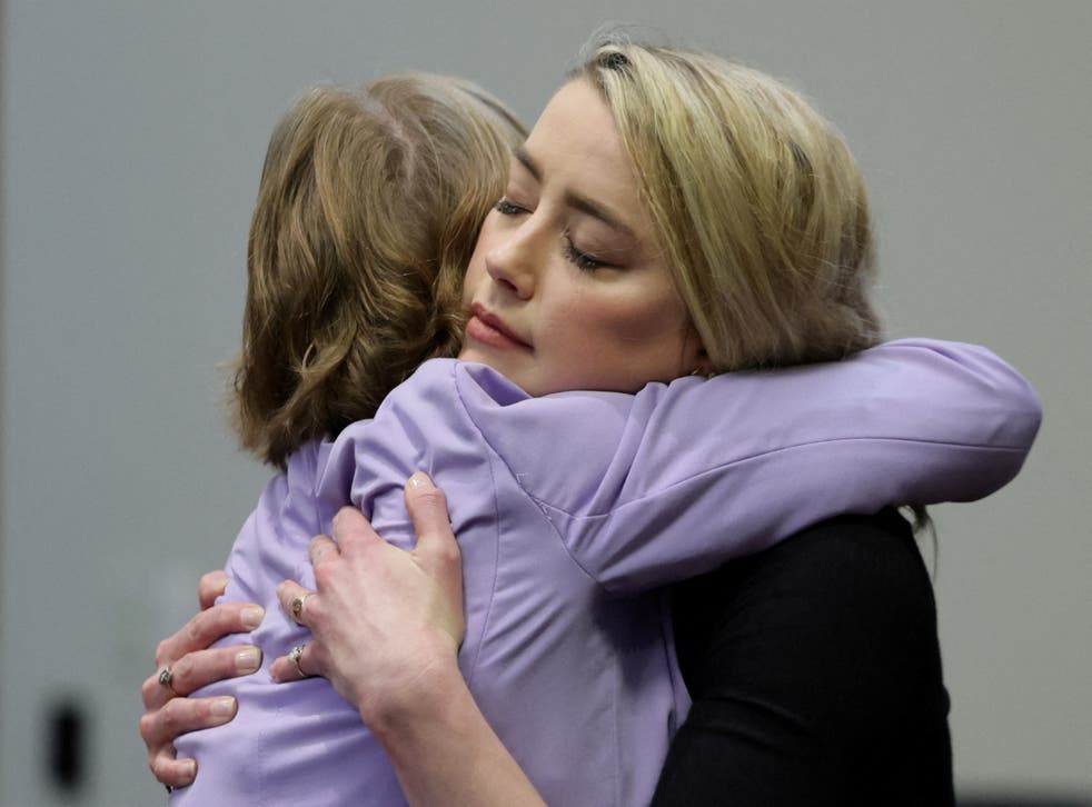 <p>Amber Heard and Elaine Bredehoft hug after the jury’s ruling  </p>