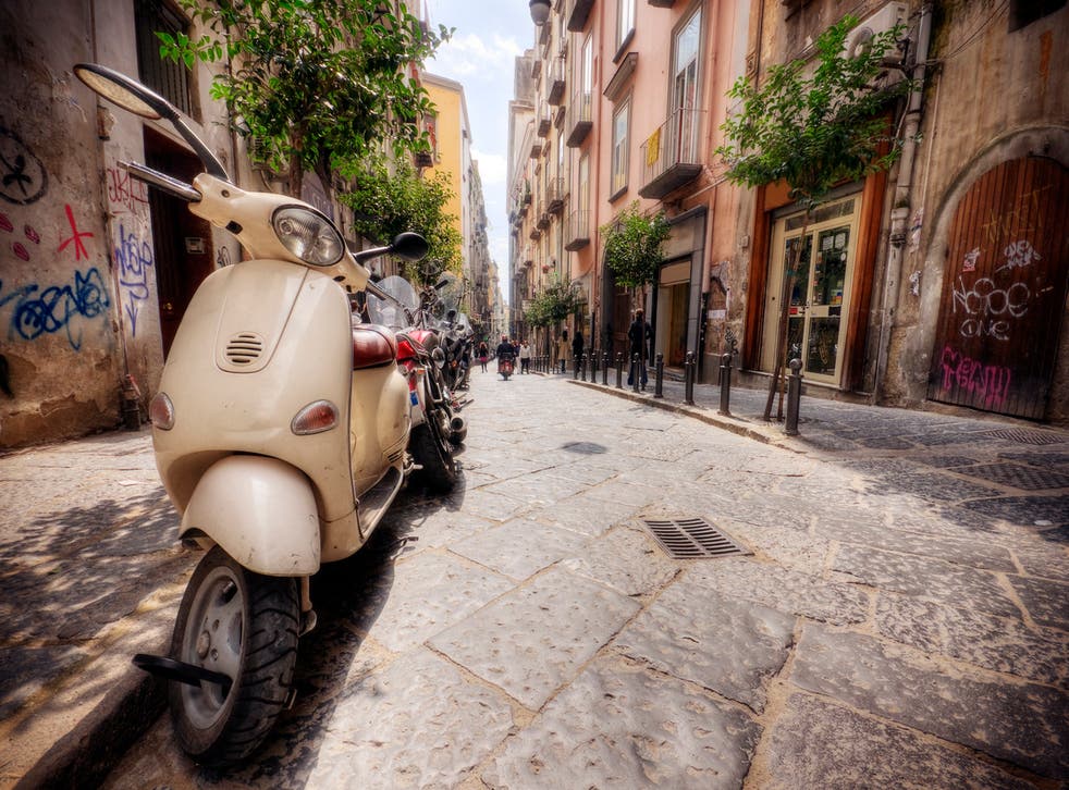 <p>Graffiti and Vespas in the old streets of Naples</p>