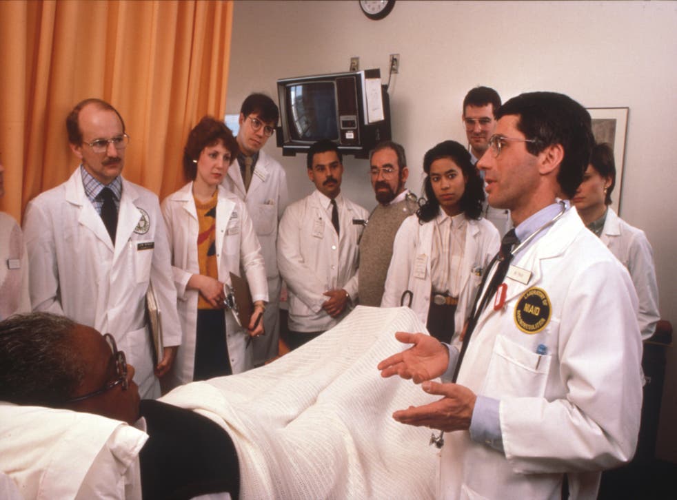 <p>Dr Fauci and treatment team with an early Aids patient at NIH during medical rounds, circa 1986</p>