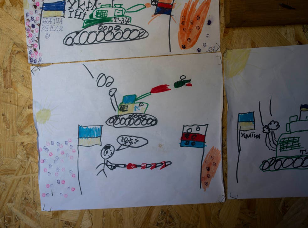 <p>Drawings made by Ukrainian children decorate a sleeping area in a trench near the front lines in Donetsk </p>