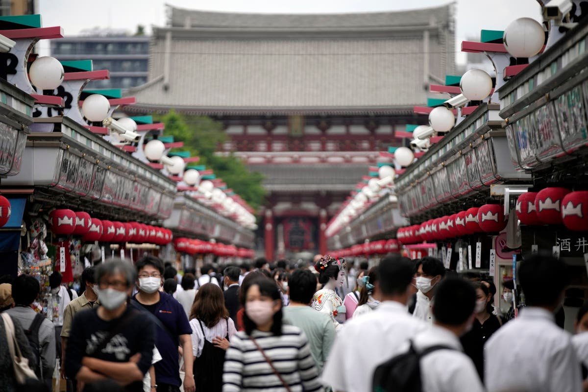 Japan eases foreign tourism ban, allows guided package tours