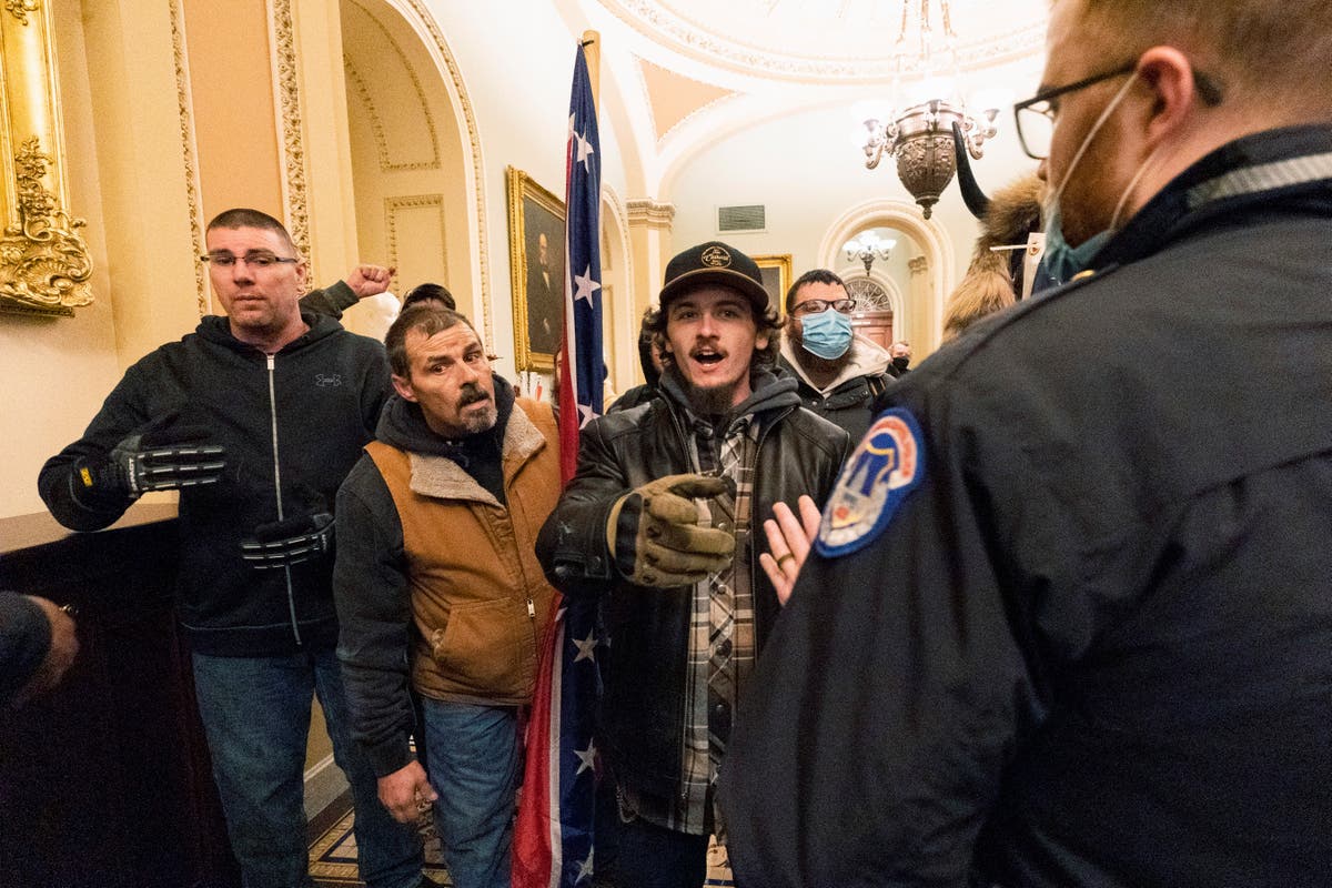 Confederate flag-toting man, son convicted in Capitol riot