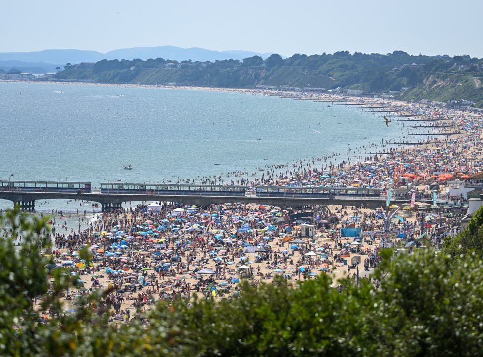 <p>Crowds flocked to Bournemouth beach as UK saw hottest day of year so far</p>