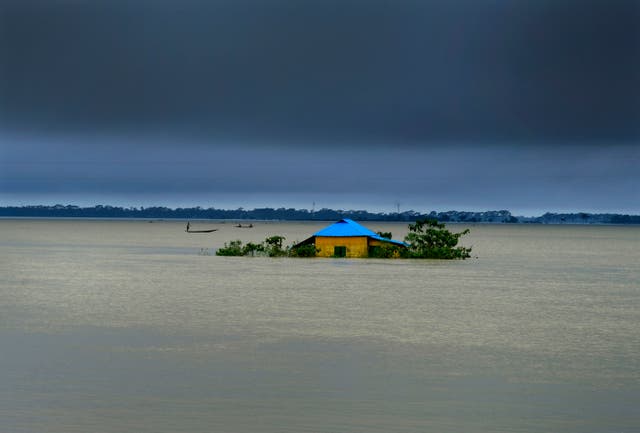 A house in marooned by flood waters in Sylhet, Bangladesh