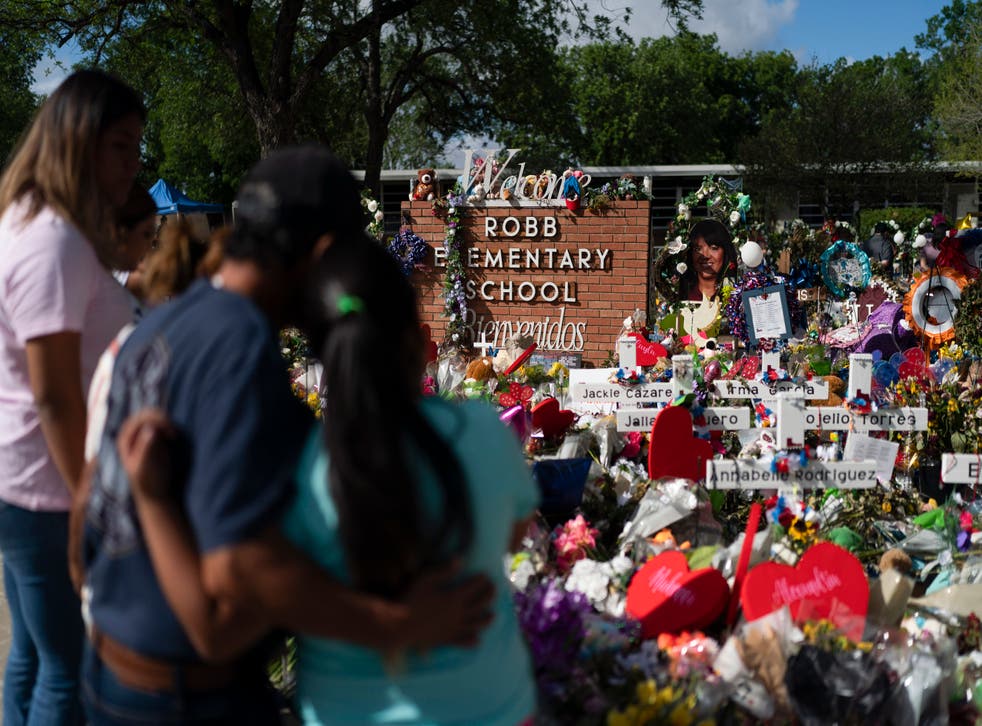 <p>People visit a memorial at Robb Elementary School in Uvalde, Texas, on June 2, 2022, to pay their respects</s>