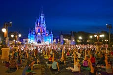 Disney workers trade costumes for yoga pants on Yoga Day