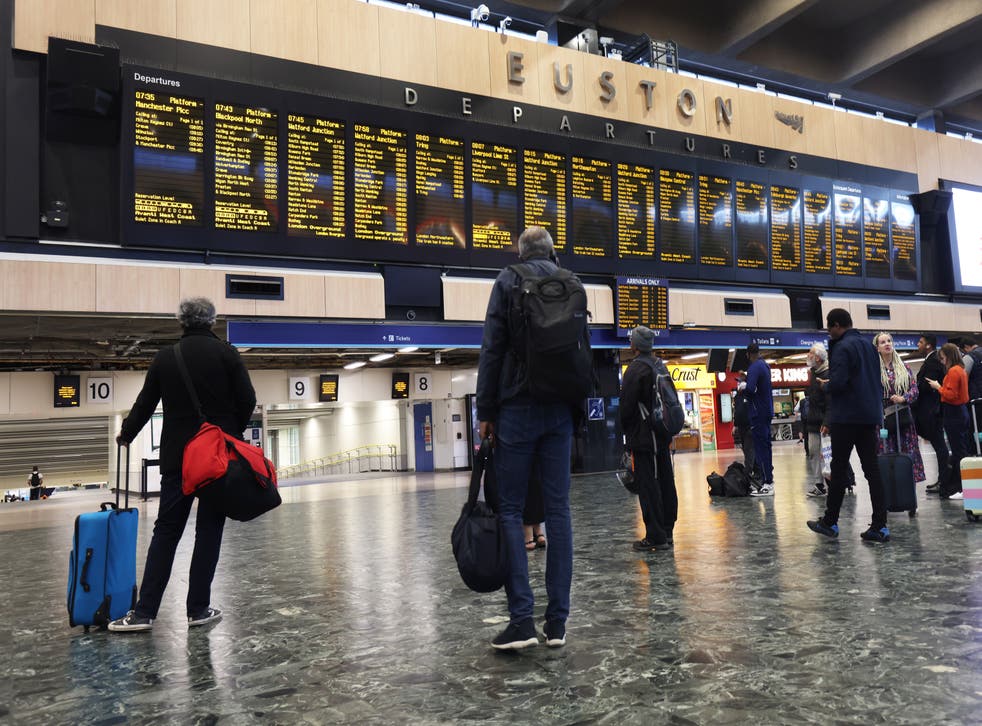 <p>Passengers at Euston station in London</s>