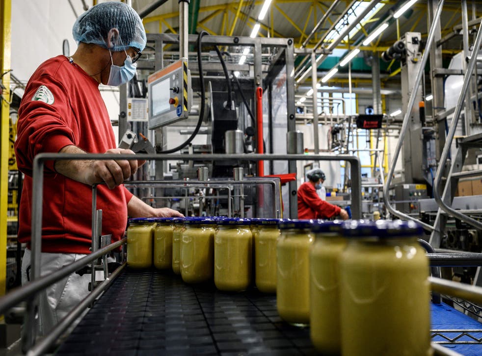 <p>Workers at a Dijon mustard factory in France last year</磷>